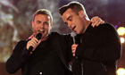 Gary Barlow and Robbie Williams on stage