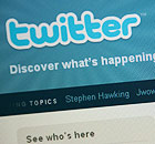 The Twitter homepage appears on a screen
