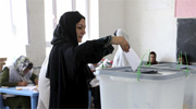 A woman votes in Afghanistan