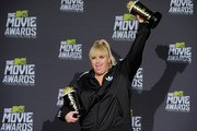 Rebel Wilson poses backstage with the awards for show host, breakthrough performance for Pitch Perfect and best musical moment for Pitch Perfect at the MTV Movie Awards. Photo / AP