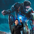 A Chinese man uses a smartphone to take his own photo with a Iron Man poster and figure during a promotional event for the Iron Man film at the Imperial Ancestral Temple in Beijing's Forbidden City. Photo / AP