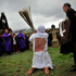 A masked penitent from La Santa Vera Cruz brotherhood beats himself while taking part in an Easter procession known as 'Los Picaos' in the small village of San Vicente de la Sonsierra, northern Spain. Photo / AP
