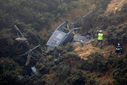 The RNZAF Iroquois helicopter crashed into a steep hillside north of Wellington. Photo / Mark Mitchell