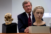 A facial reconstruction of "Jane of Jamestown" sits alongside the recovered skull and small cuts can be seen on the bones (right). Photo / AP