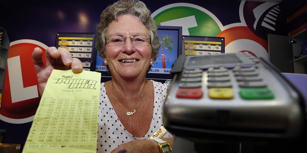 Bayfair Lotto shop assistant Sharyn Burns was flat out checking tickets after news the store had sold a $1million ticket. Photo/George Novak