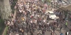 Thai PM calls elections as 140,000 join protest 