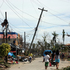 Residents walk past the devastation caused by Typhoon Haiyan in Daanbantayan town, north Cebu, central Philippines. Photo / AP