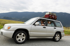 Tune your car and your driving to save money on your summer road trip.