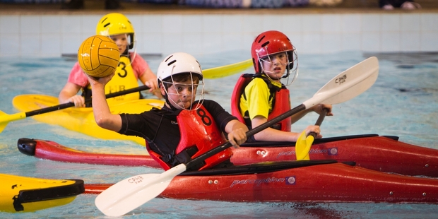 Canoe polo is fast-paced and children often topple the opposition's boats.