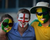 Fans of both the Australian and English cricket teams pose for a photo during day 1 of the first Ashes Test at the Gabba in Brisbane, Thursday.