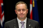 John Key - he charms us with his fetching smile and soothing words to ebb our resistance away. Photo / Mark Mitchell
