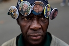 Badges of Nelson Mandela for sale in Soweto. Photo / AP