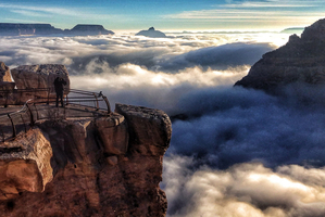 Tourists at Mather Point, Arizona, look out over a rare total cloud inversion at the Grand Canyon. Photo / AP