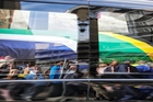 A vehicle carrying the body of Nelson Mandela makes its way through the streets of Pretoria. Photo / AP