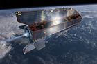 Research satellite GOCE flies above Earth. Photo / European Space Agency/AP