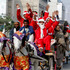 People dressed as Santa Claus ride a horse cart ahead of Christmas celebrations in Lahore, Pakistan. Photo / AP