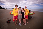 Lifeguards James Campbell (left) and Nick Tomkins helped to save Casey Trumper (second left), Ashleigh Neal and two would-be rescuers at Orewa Beach. Photo / Dean Purcell