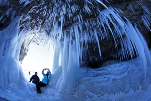 People take pictures of each other in a cave at Apostle Islands National Lakeshore in northern Wisconsin, which has been transformed into a dazzling display of ice sculptures. Photo / AP