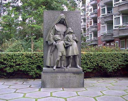 The memorial in front of the Jeanne D'arc School for the killed civilians