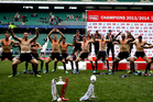 The All Blacks Sevens perform a haka in front of the two trophies after winning the IRB Sevens title and the London Sevens. Photo / Getty Images