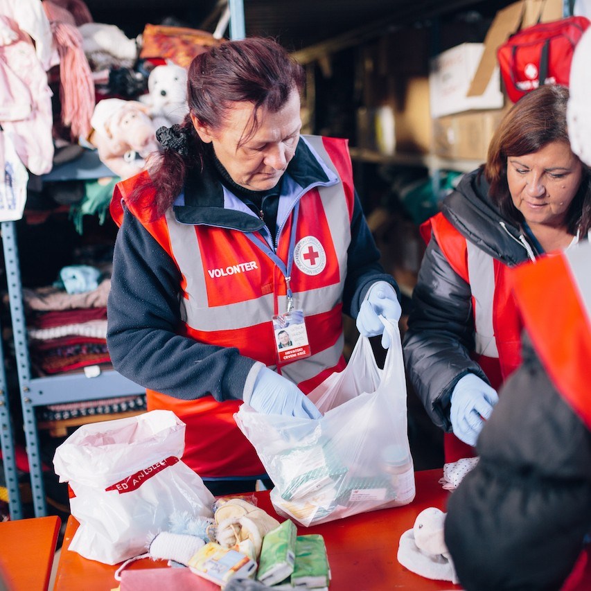Slavonski Brod transit camp in Croatia. Croatian Red Cross volunteers sort donated clothes which are then given to refugees.