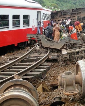 Passenger escape the site of a train derailment in Eseka, Cameroon. (AFP)