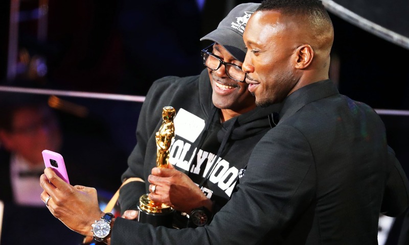 Mahershala Ali poses for a selfie with a man during a skit. —Reuters