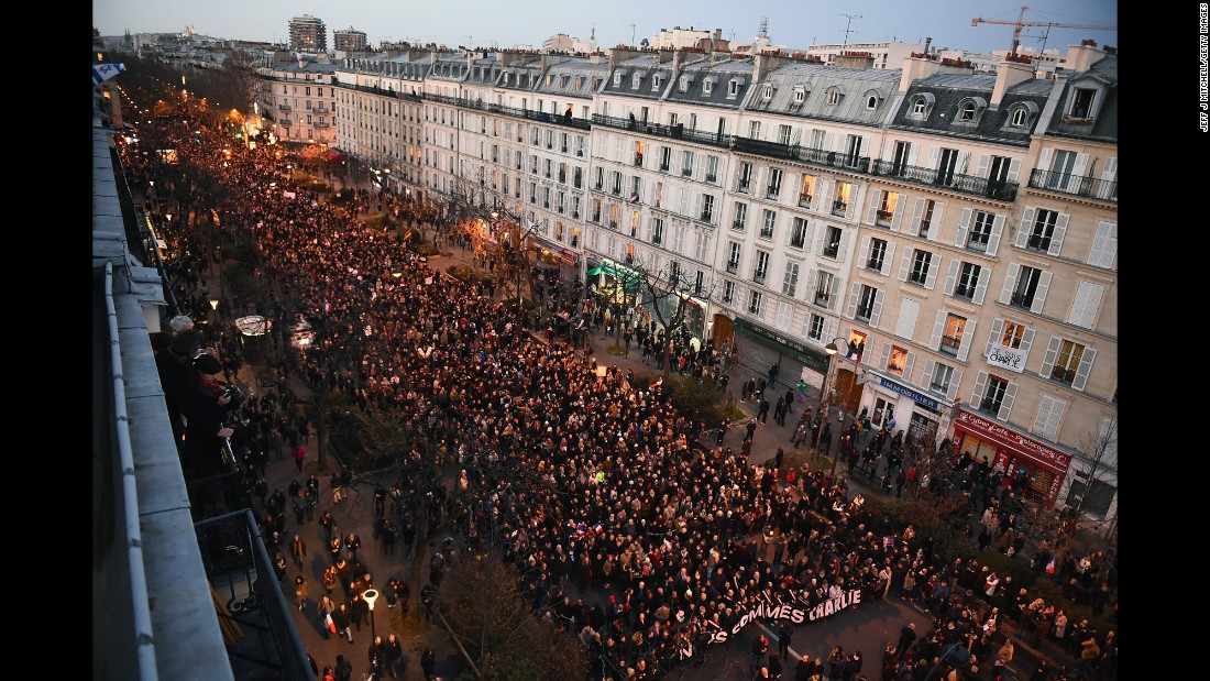 People march down Boulevard Voltaire from the Place de la Republique to the Place de la Nation in Paris on Sunday, January 11. An estimated 1.5 million people joined world leaders in the &quot;unity rally.&quot; 