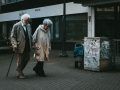 older couple walking on street