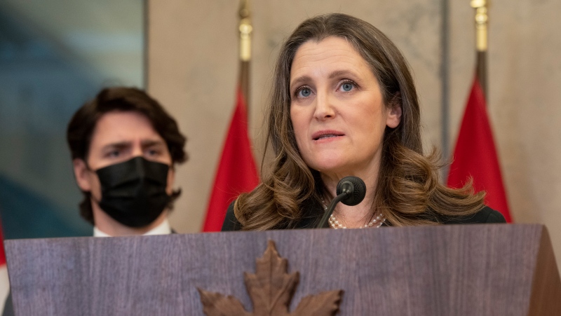 Canadian Prime Minister Justin Trudeau looks on as Deputy Prime Minister and Finance Minister Chrystia Freeland speaks during a news conference announcing the Emergencies Act will be invoked to deal with protests, Monday, February 14, 2022 in Ottawa. Trudeau says he has invoked the Emergencies Act to bring to an end antigovernment blockades he describes as illegal and not about peaceful protest. THE CANADIAN PRESS/Adrian WyldTHE CANADIAN PRESS/Adrian Wyld 