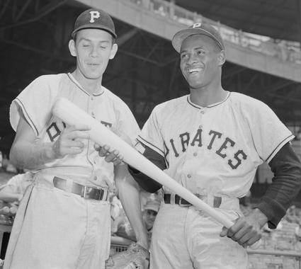 Roberto Clemente, right, chats with Pirates teammate Cholly Naranjo in this 1956 photo. (Osvaldo Salas/National Baseball Hall of Fame and Museum)