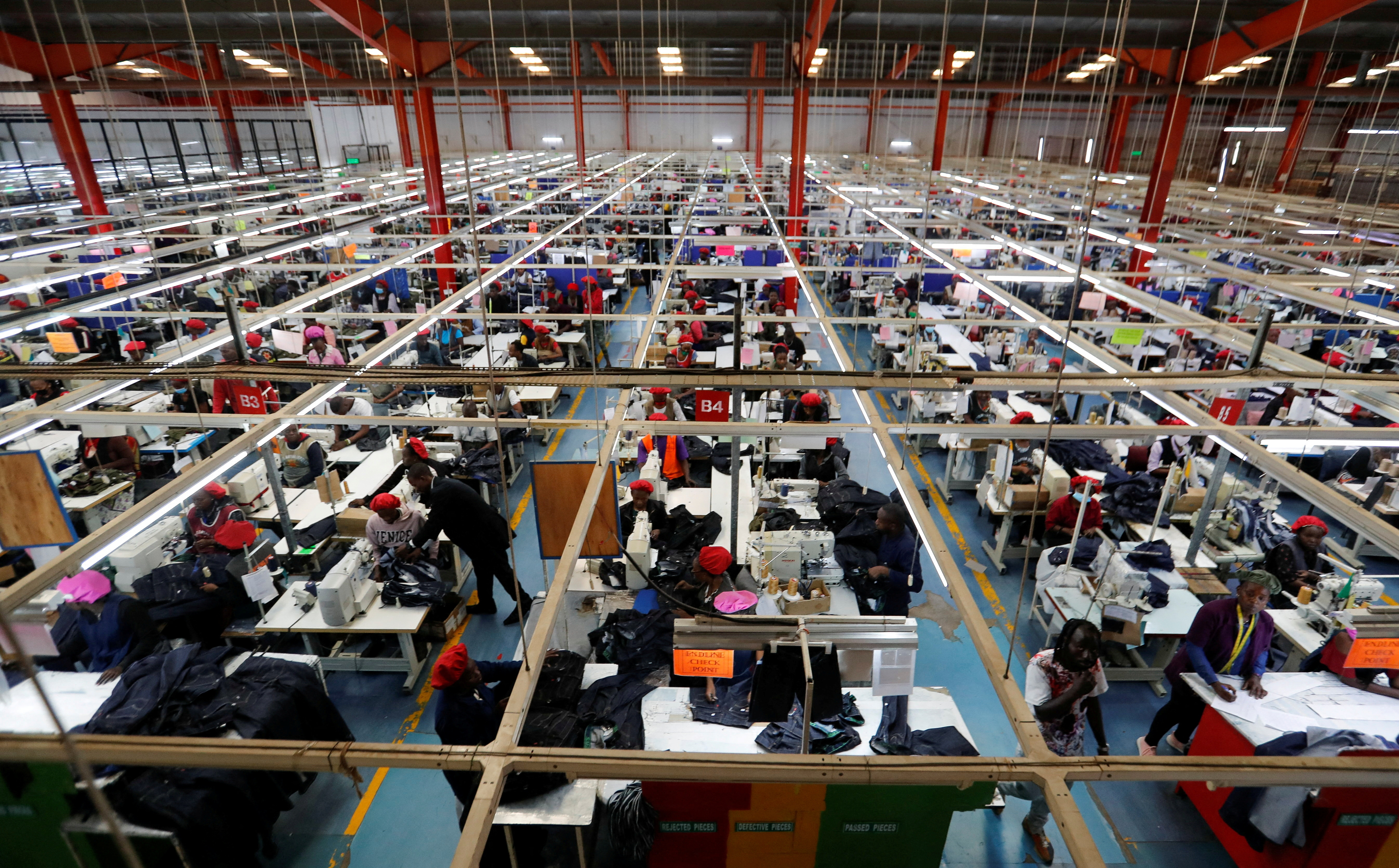Kenyan workers prepare clothes for export at the United Aryan EPZ factory in Ruaraka district of Nairobi