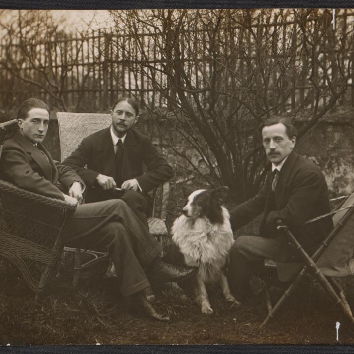 Marcel Duchamp, Jacques Villon, Raymond Duchamp-Villon, and Villon's dog Pipe in the garden of Villon's studio, Puteaux, France,