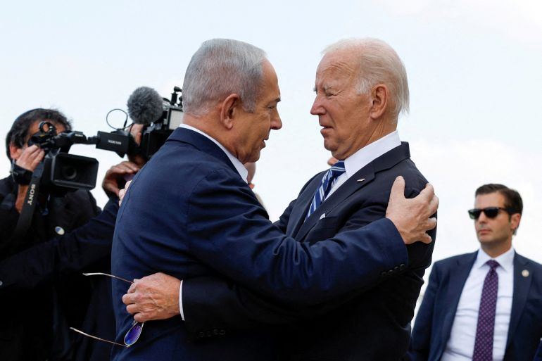 U.S. President Joe Biden is welcomed by Israeli Prime Minster Benjamin Netanyahu, as he visits Israel amid the ongoing conflict between Israel and Hamas, in Tel Aviv, Israel, October 18, 2023. REUTERS/Evelyn Hockstein TPX IMAGES OF THE DAY