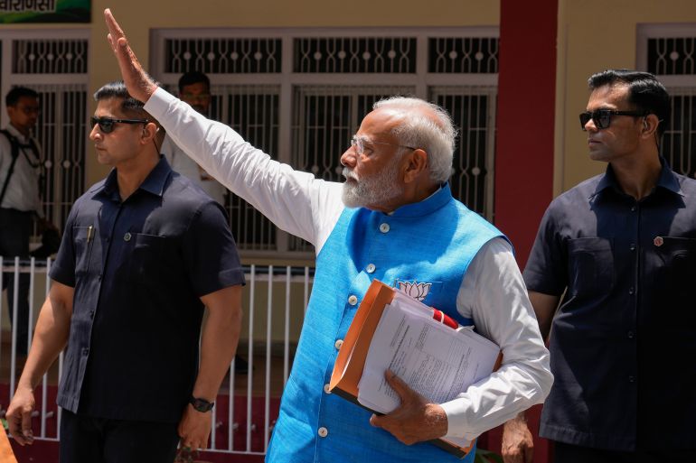Indian Prime Minister Narendra Modi, waves to the public as he returns after filing his nomination papers to contest as a candidate for the parliamentary elections in Varanasi, Uttar Pradesh state, India, Tuesday, May 14, 2024. Varanasi will go to polls on June 1 in the seventh and last phase of the six-week-long election. (AP Photo/ Rajesh Kumar Singh)