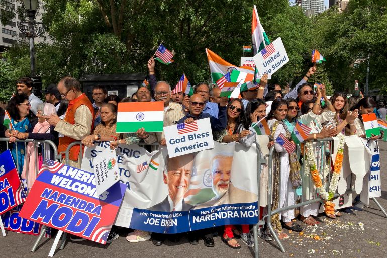 Supporters gather near the United Nations headquarters to welcome India Prime Minister Narendra Modi, Wednesday, June 21, 2023, in New York. Modi joined diplomats and dignitaries at the United Nations for a morning session of yoga, praising it as "truly universal" and "a way of life." (AP Photo/Edith M. Lederer)