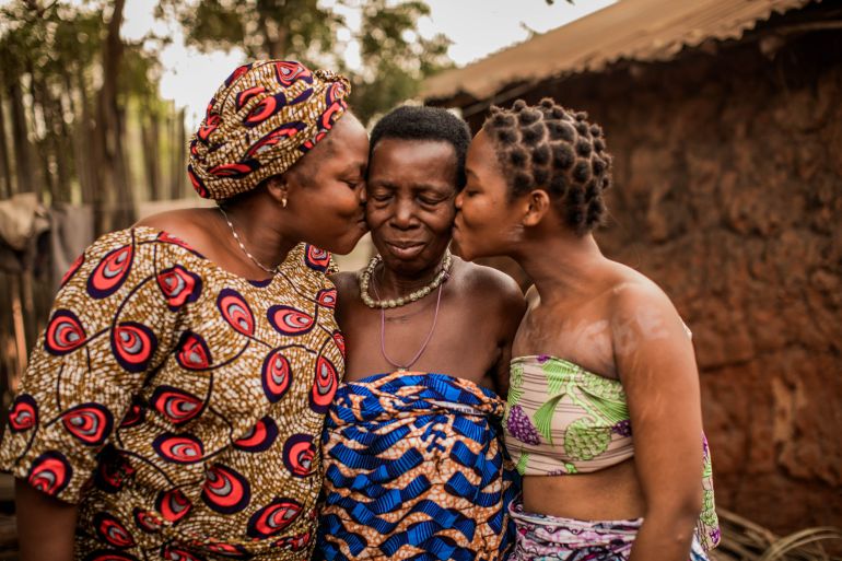 Teenager Blanche, 18 (pictured right), with her grandmother, Angel, 80 (centre), and her mother, Pierrette, 42 (left), both of whom Blanche calls ‘Dada’, at home in Benin.