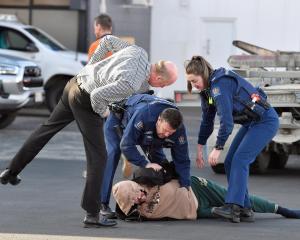 Police, with the help of a member of the public, arrest a man in Andersons Bay Rd in relation to...