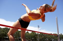 Female athlete doing high jump