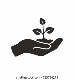 Plant in hand. Vector icon. Stock Vector