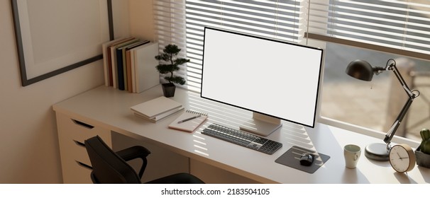 Minimal white home workspace or office studio interior with PC computer white screen mockup, table lamp, stationery and decors against the window with window blinds. 3d rendering, 3d illustration Stockillustration