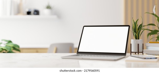 Workspace tabletop with notebook laptop white screen mockup, decor and copy space for montage your product display over blurred minimal living room in the background. 3d rendering, 3d illustration Stockillustration