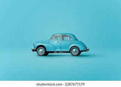 スタジオで青の背景に黒い車輪が止まっているビンテージブルーのレトロな自動車の置物のイラスト素材