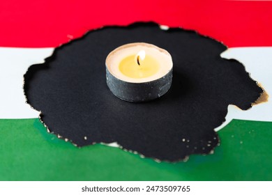 Стоковая фотография: 1956. october 23 - memorial day, hole in hungarian flag and candle