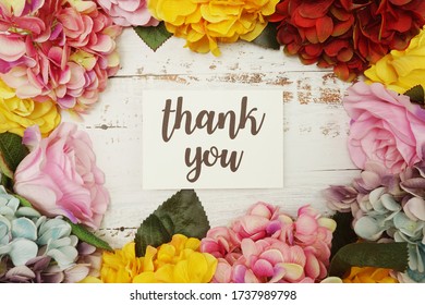 Thank you Card with colorful flowers border frame on wooden background स्टॉक फोटो