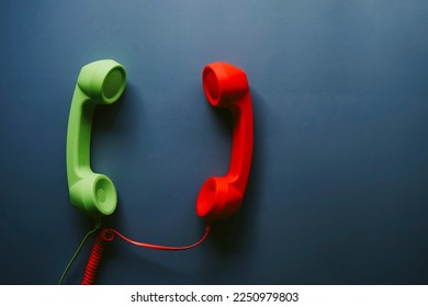 Top view of retro telephone handsets placed on gray background Stock Photo