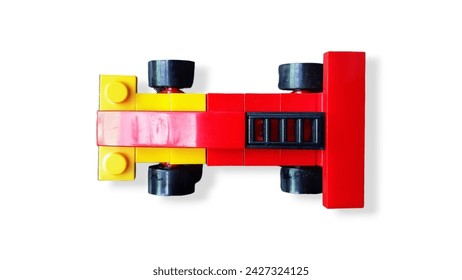 Стоковая фотография: Toy car children's plastic bricks or blocks toy on white isolated background.