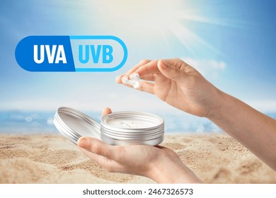 Two hands are shown applying sunscreen from a tin container with a graphic  Stockfotó