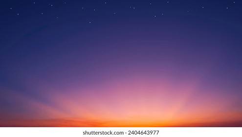 暗い青い夜空の背景にドラマチックな夕暮れの空と壮大なカラフルな光の写真素材