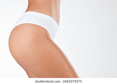 Underwear, woman and body for skincare in studio for beauty, lingerie and hair removal with glow, health and dermatology. Female person, fresh and cosmetics, cellulite and shine on white background Stockfotó